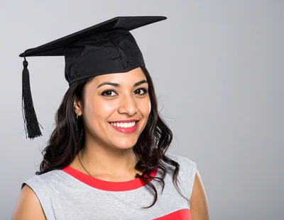 Smiling Young Woman Wearing A Graduation Cap