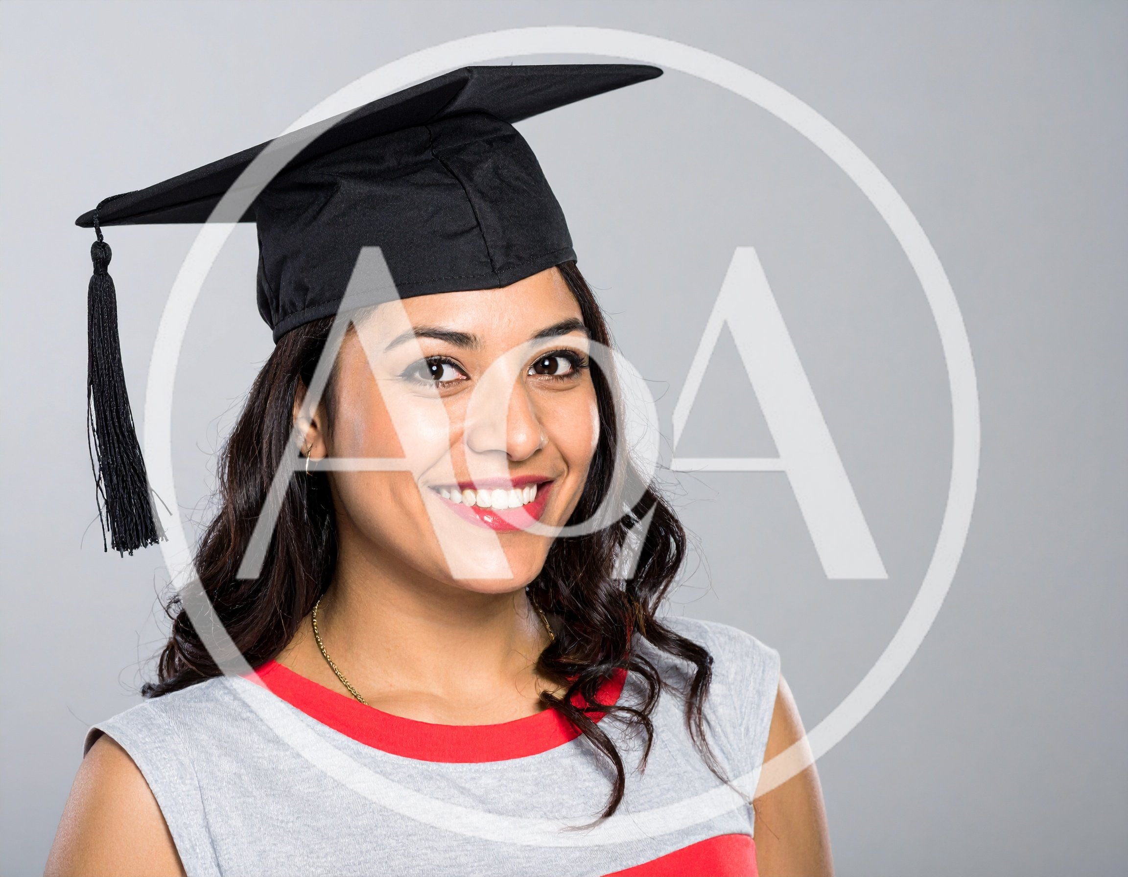 Smiling Young Woman Wearing A Graduation Cap