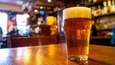 Pint Of Golden Beer On A Pub Table