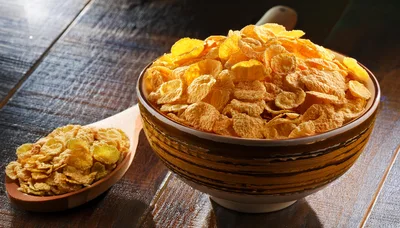 Bowl Of Corn Flakes With A Wooden Spoon
