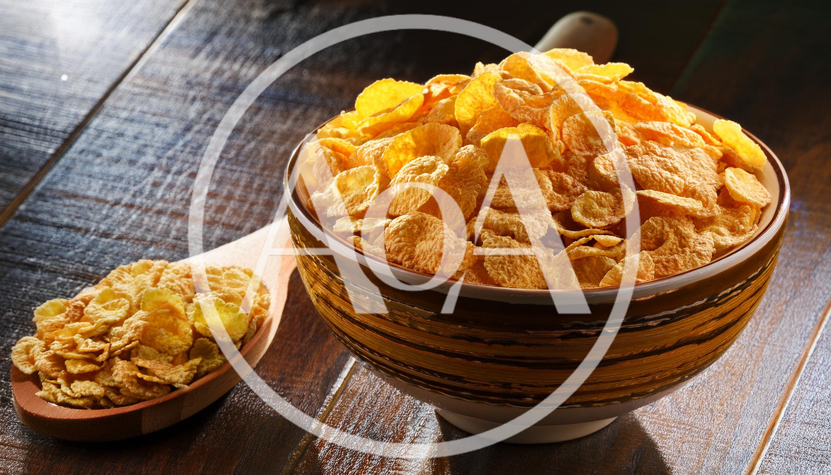 Bowl Of Corn Flakes With A Wooden Spoon