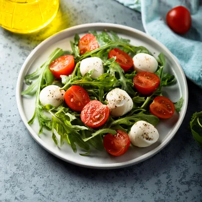 Fresh Caprese Salad With Arugula And Mozzarella