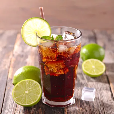 Refreshing Glass Of Cola With Lime And Ice