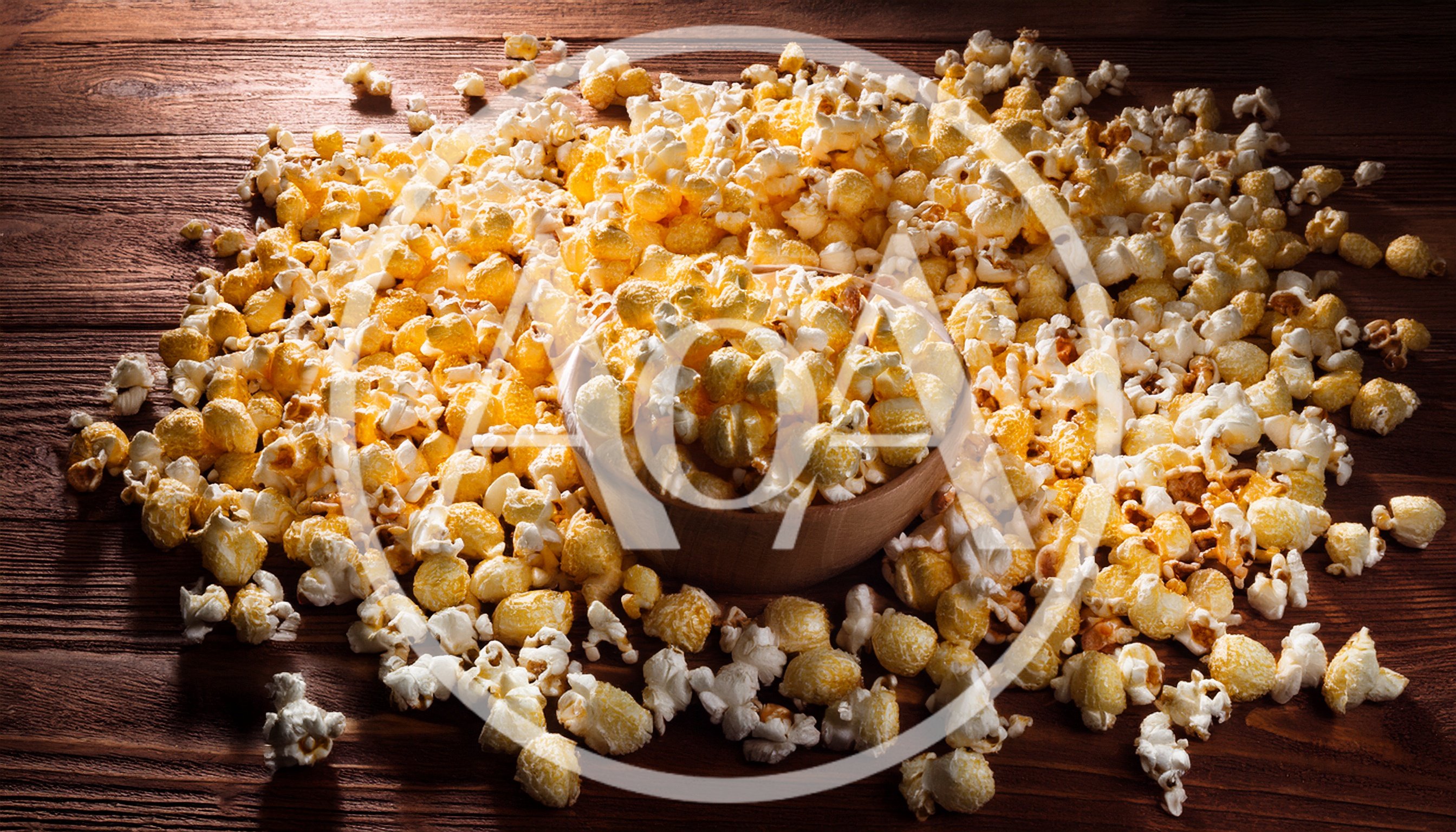 Wooden Bowl Filled With Fresh Buttery Popcorn