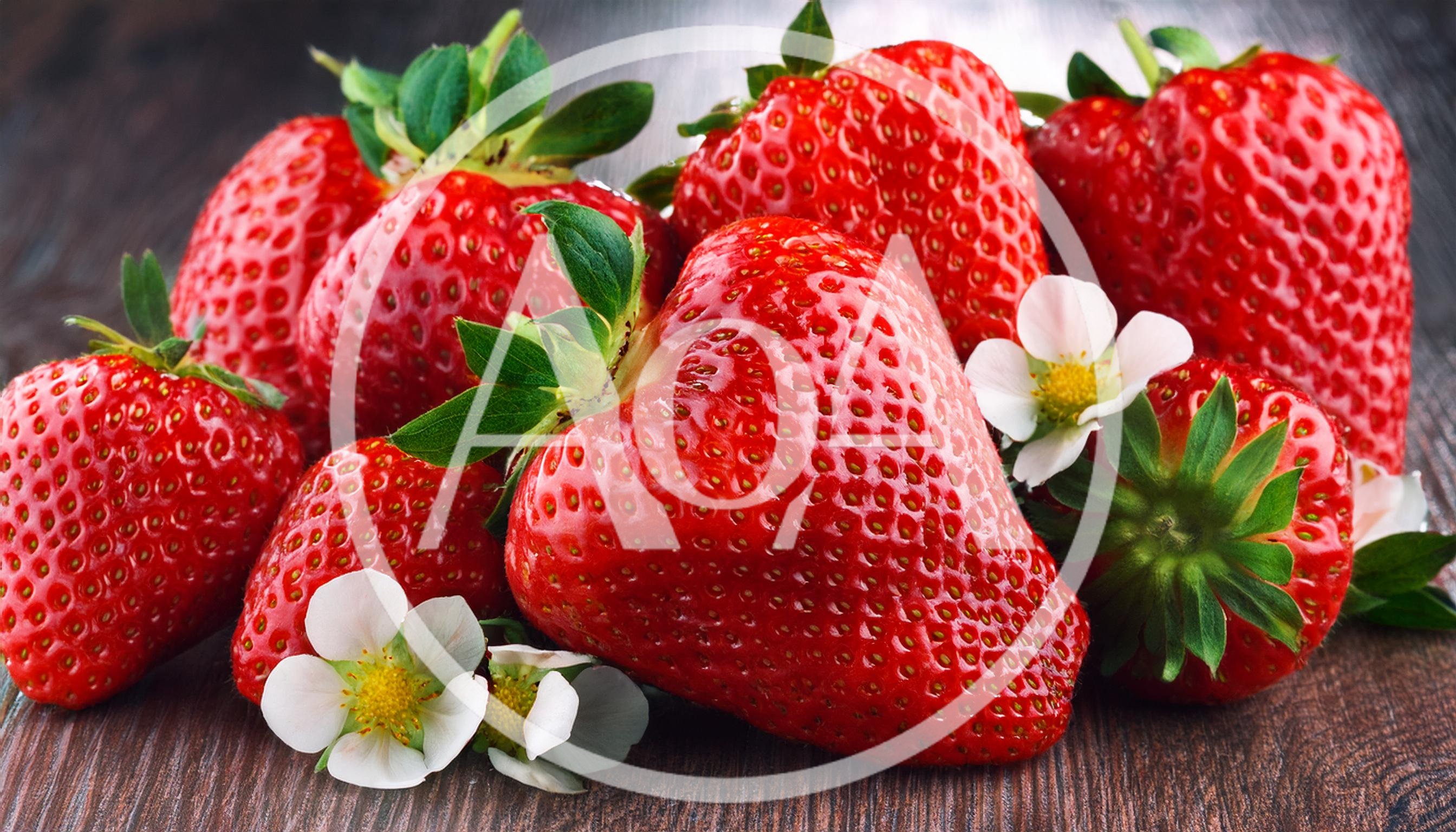 Fresh Ripe Strawberries With Blossoms On Wooden Surface