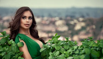 Beautiful Woman In Green Dress Posing With Mint Leaves