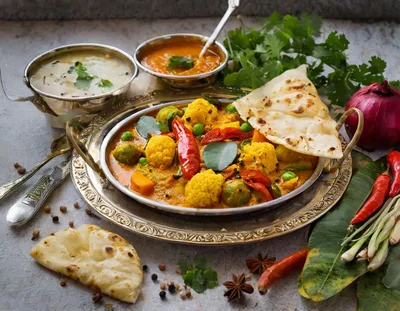 Traditional Indian Vegetable Curry With Naan Bread