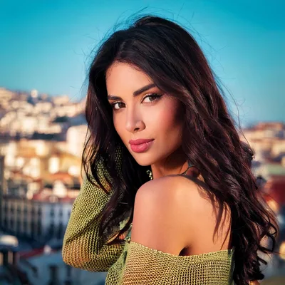 Portrait Of A Beautiful Woman In A Green Top