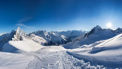 Panoramic View Of Snowy Mountain Peaks In Winter