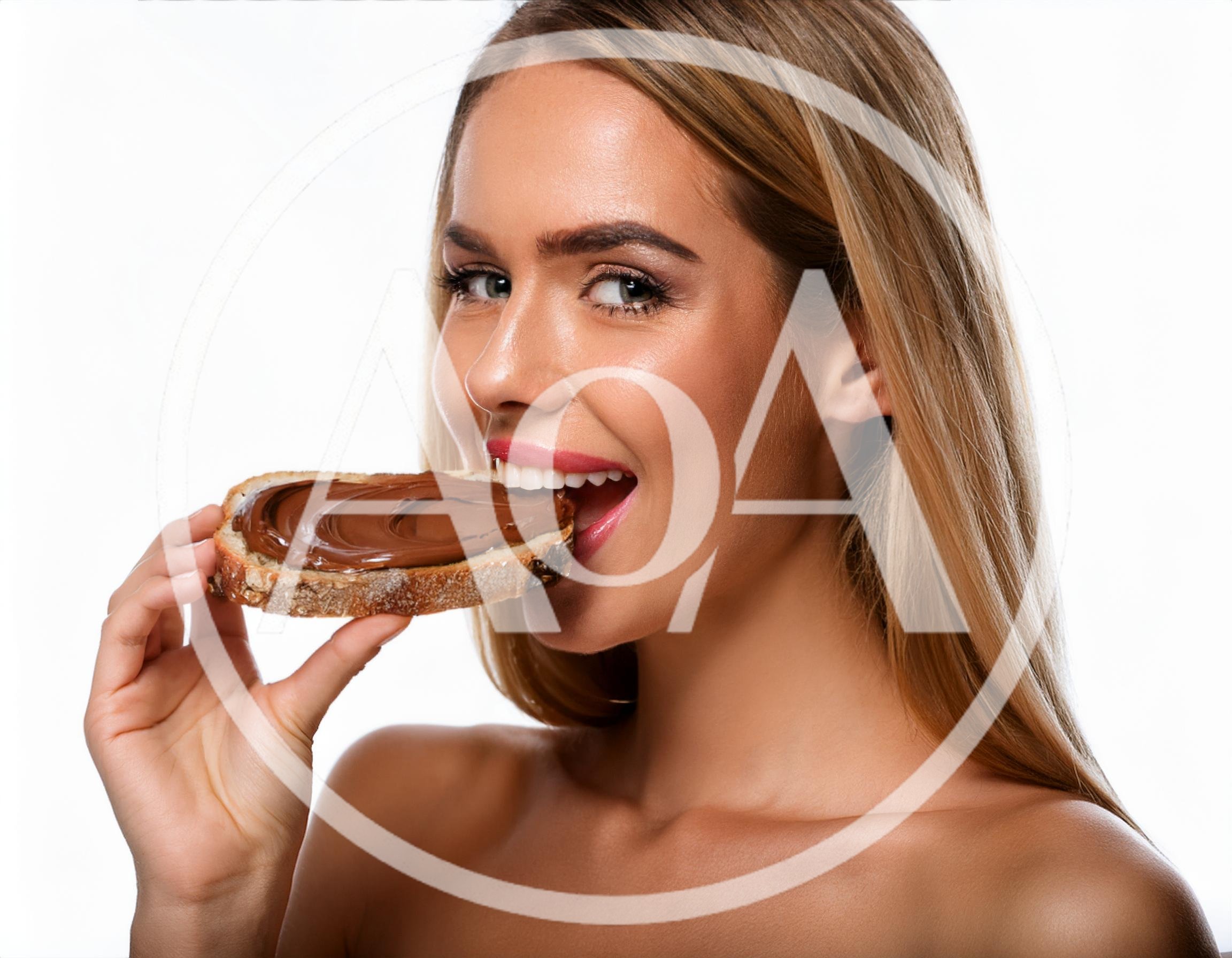 Beautiful Woman Eating A Slice Of Chocolate Spread Bread
