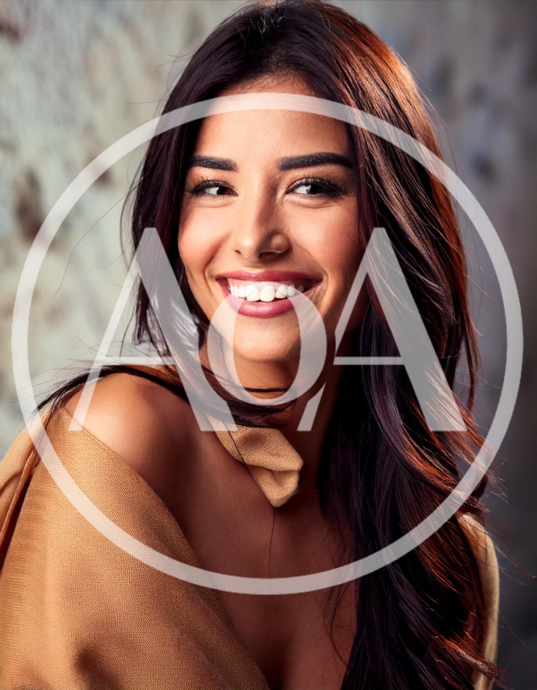 Portrait Of A Smiling Woman With Long Dark Hair