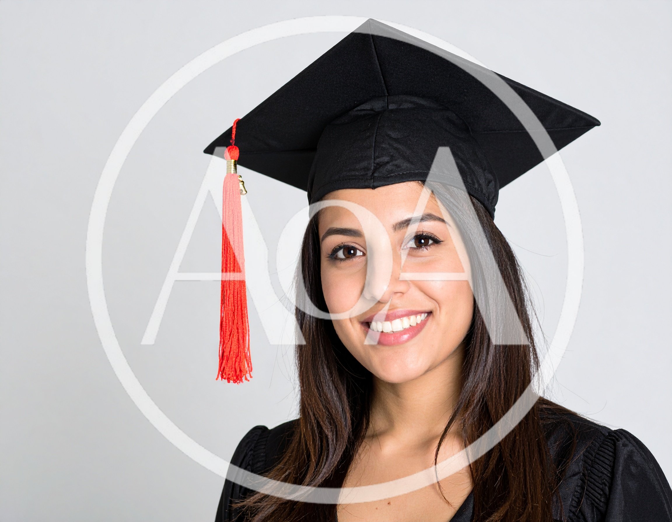 Smiling Female Graduate Wearing Academic Cap And Gown