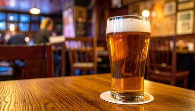 Pint Of Beer On A Wooden Pub Table