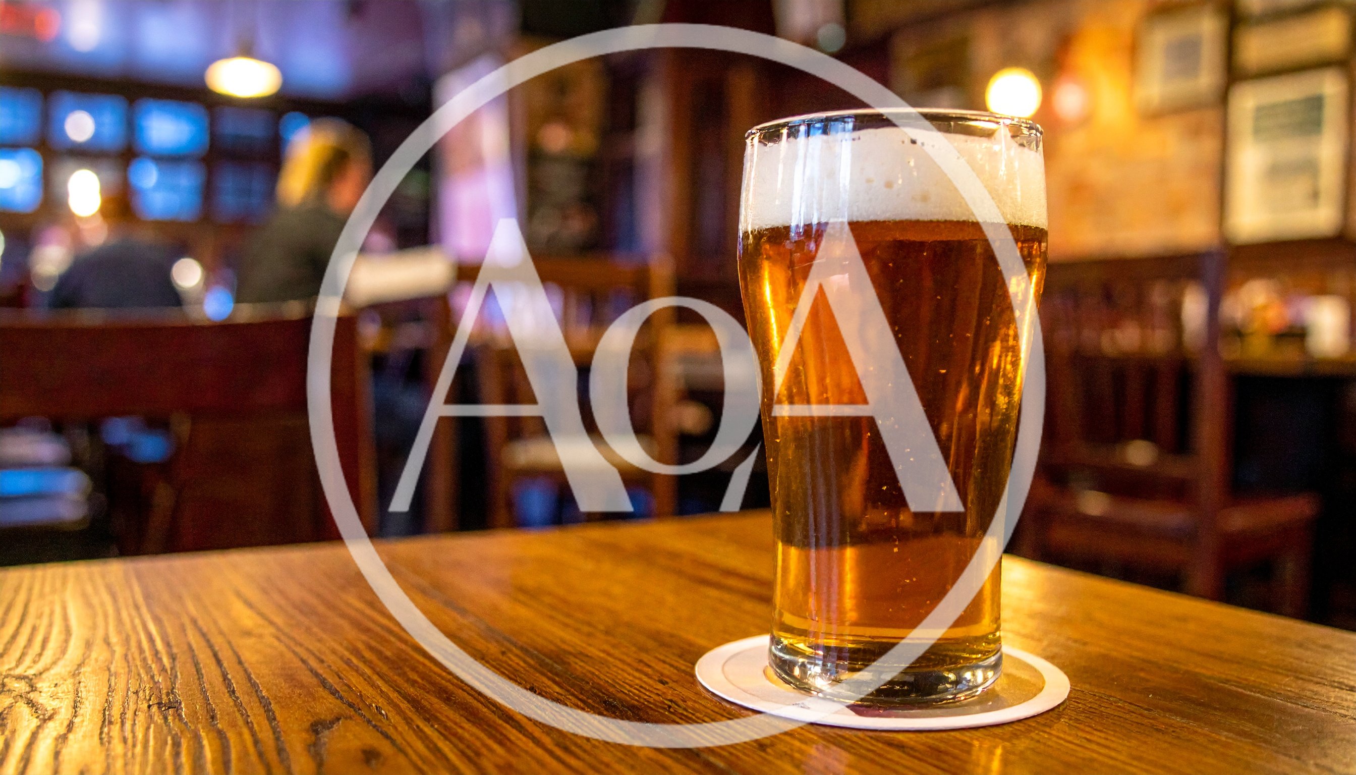Pint Of Beer On A Wooden Pub Table