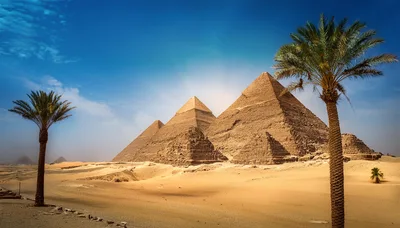 The Great Pyramids Of Giza Under A Clear Blue Sky