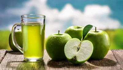 Glass Of Fresh Green Apple Juice With Whole Apples