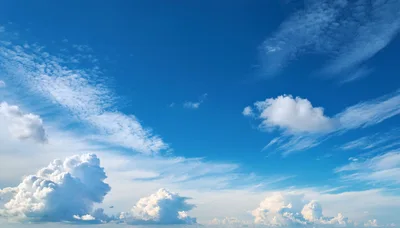 White Cumulus Clouds Against A Deep Blue Sky