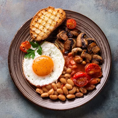 Full English Breakfast Plate With Fried Egg And Beans