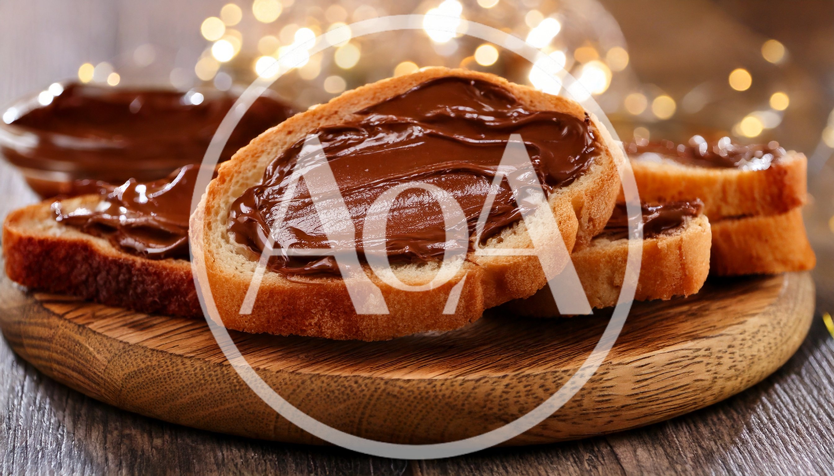 Slices Of Bread With Chocolate Spread On Wooden Board