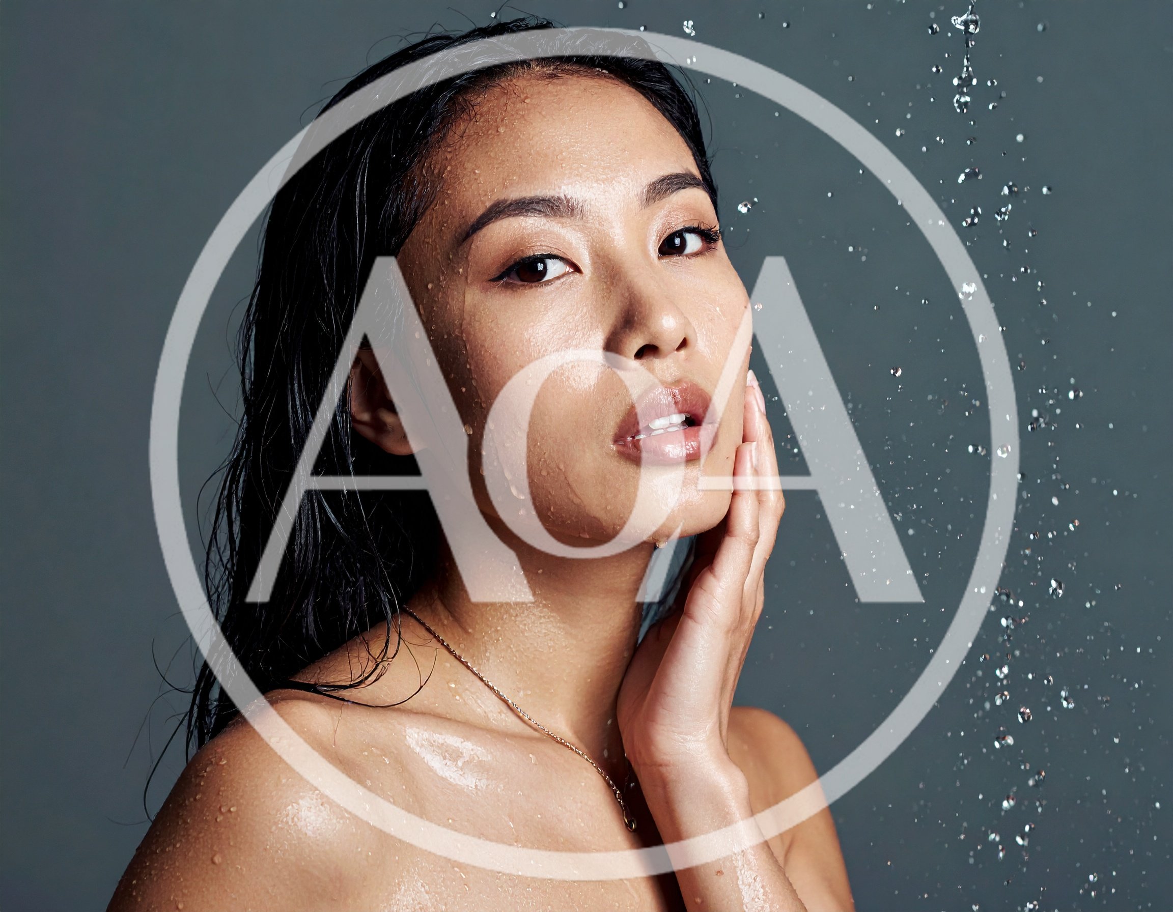 Young Asian Woman With Wet Skin Under Water Spray