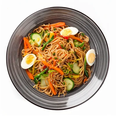 Top View Of Soba Noodle Salad With Vegetables And Eggs