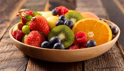 Fresh Mixed Fruit Bowl On Rustic Wooden Table