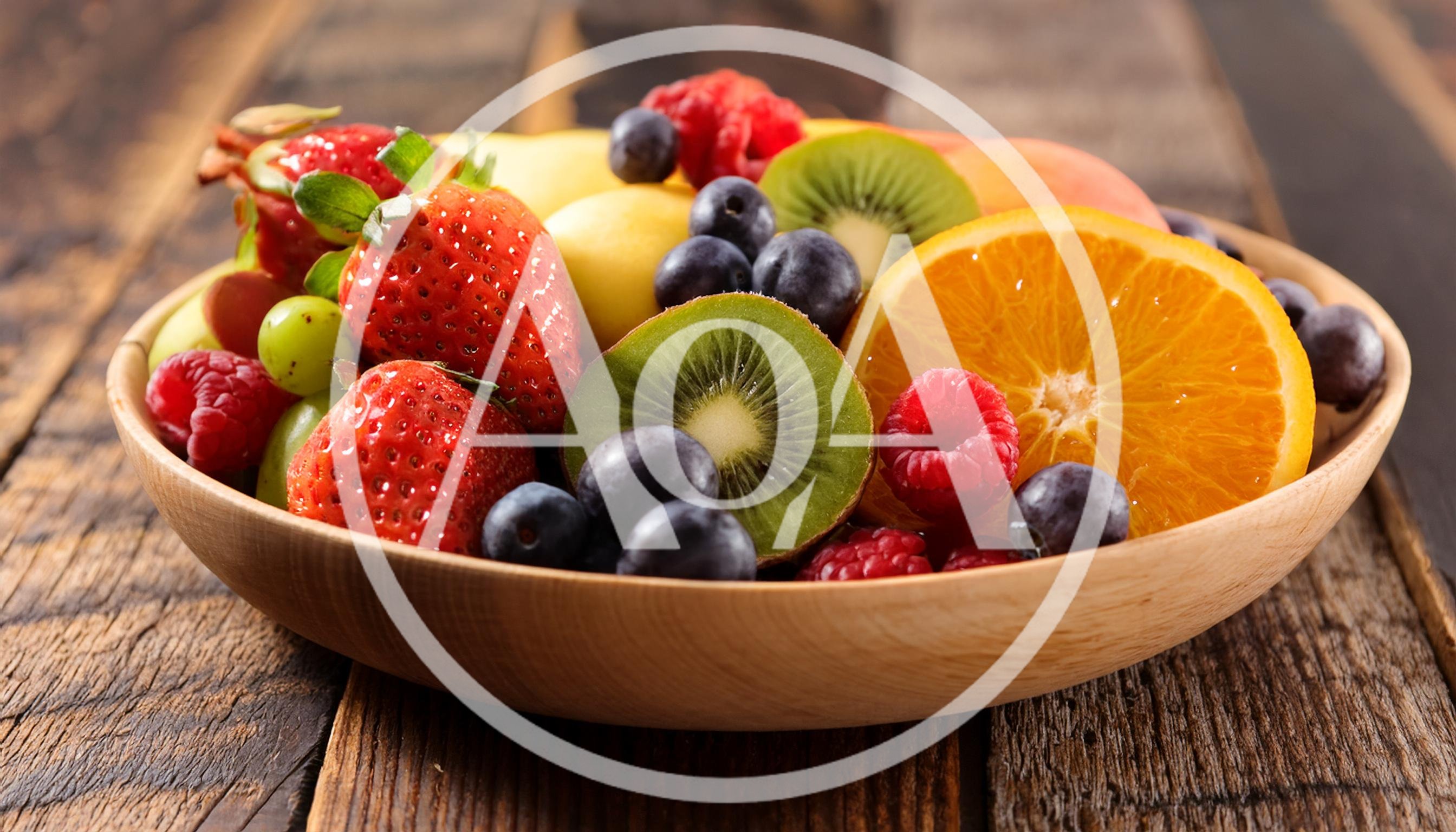 Fresh Mixed Fruit Bowl On Rustic Wooden Table