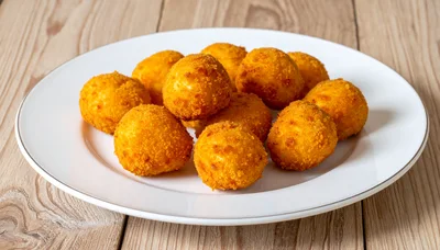 Fried Cheese Balls on a White Plate