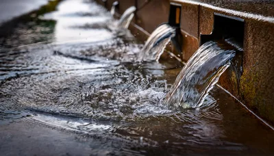 Water Flowing From Stone Fountain Spouts