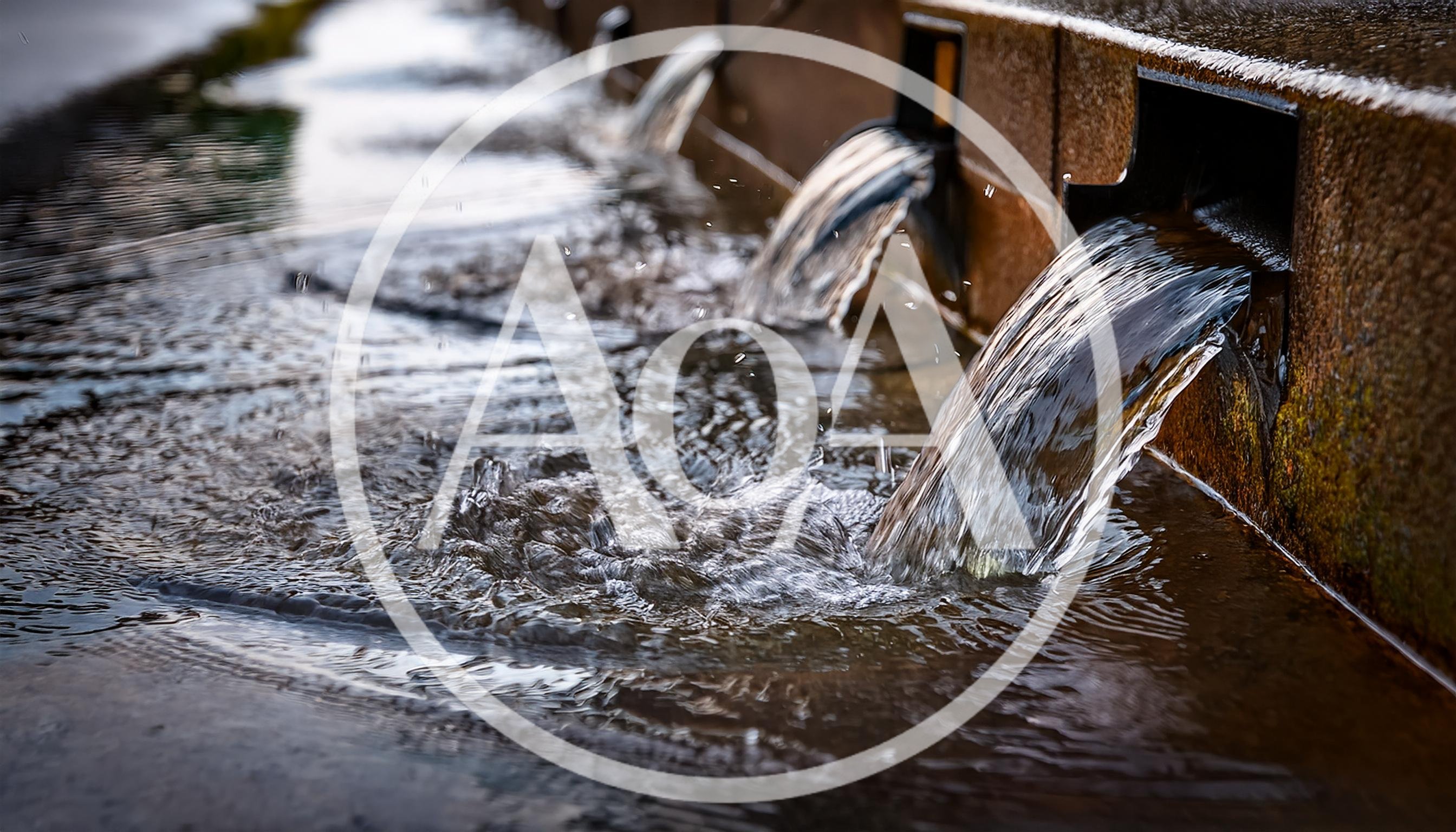Water Flowing From Stone Fountain Spouts