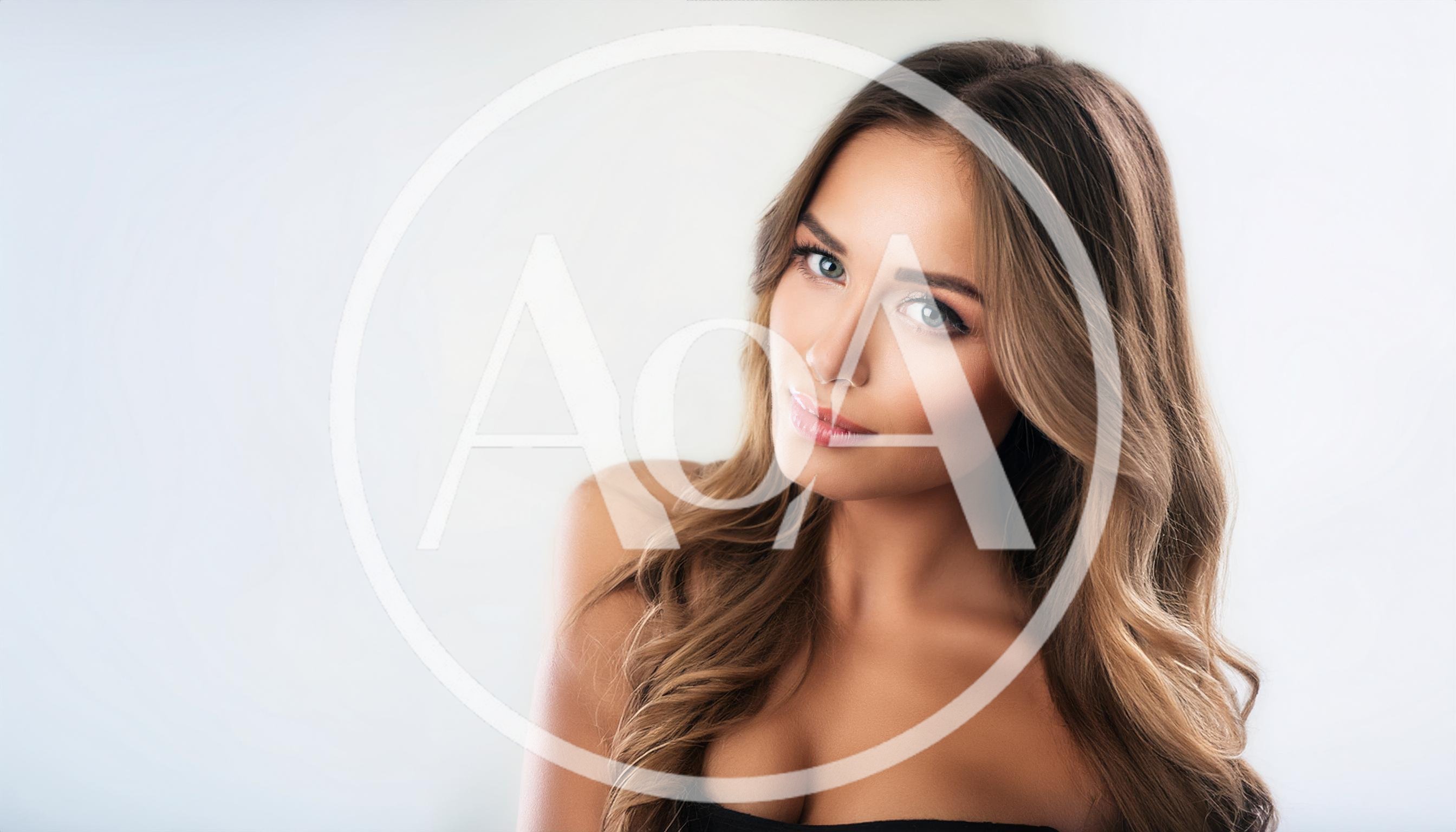 Portrait Of A Beautiful Young Woman With Wavy Hair