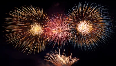 Vibrant Multi-Colored Fireworks Display In Night Sky