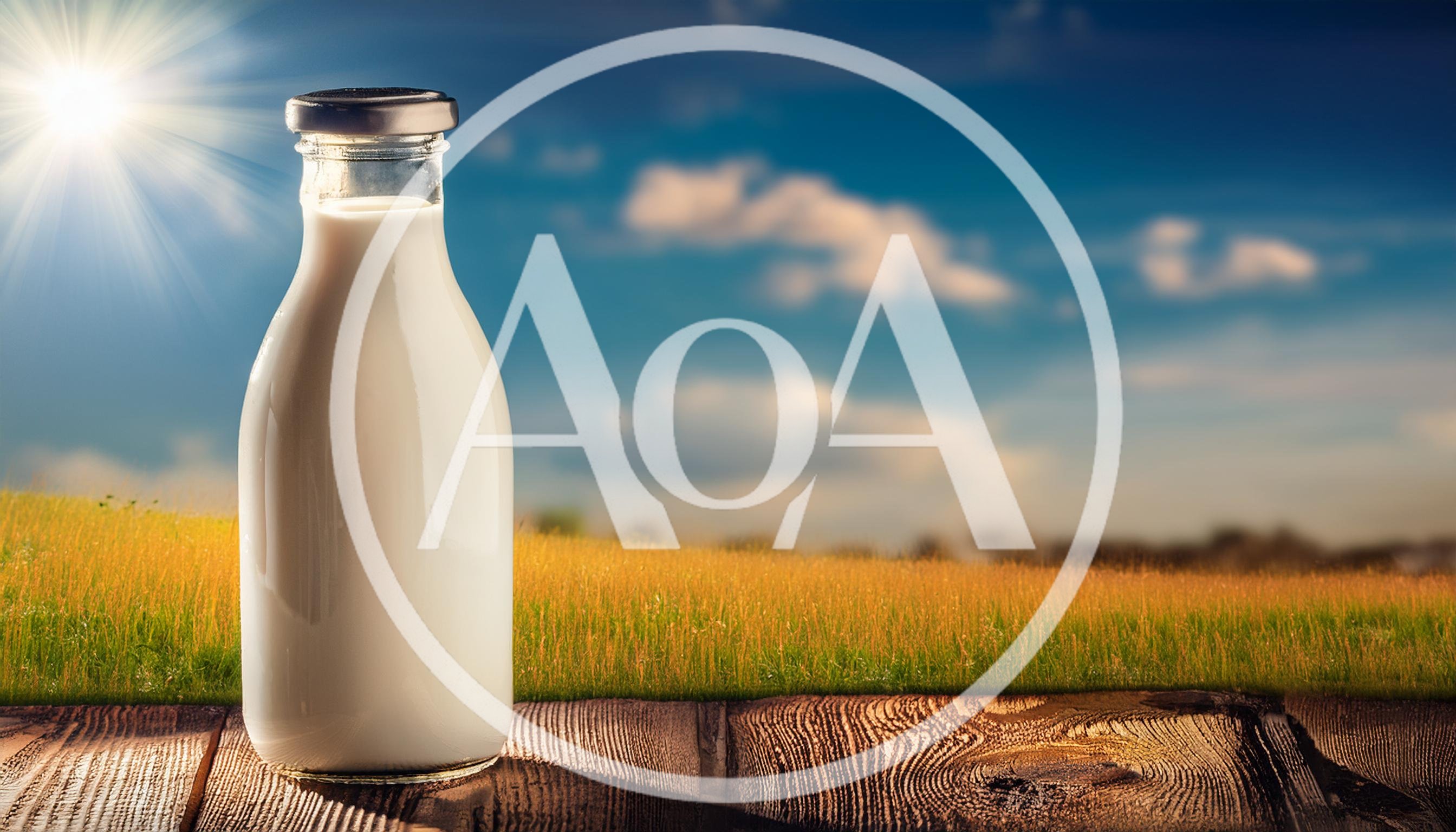Glass Bottle Of Fresh Milk On Wooden Table