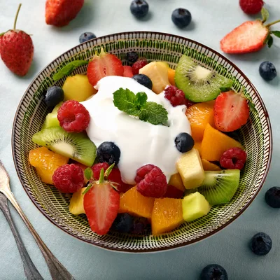 Fresh Fruit Salad Bowl With Yogurt And Mint