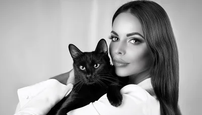 Beautiful Woman Holding A Black Cat