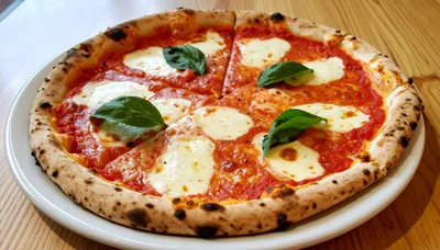 Fresh Margherita Pizza on a White Plate