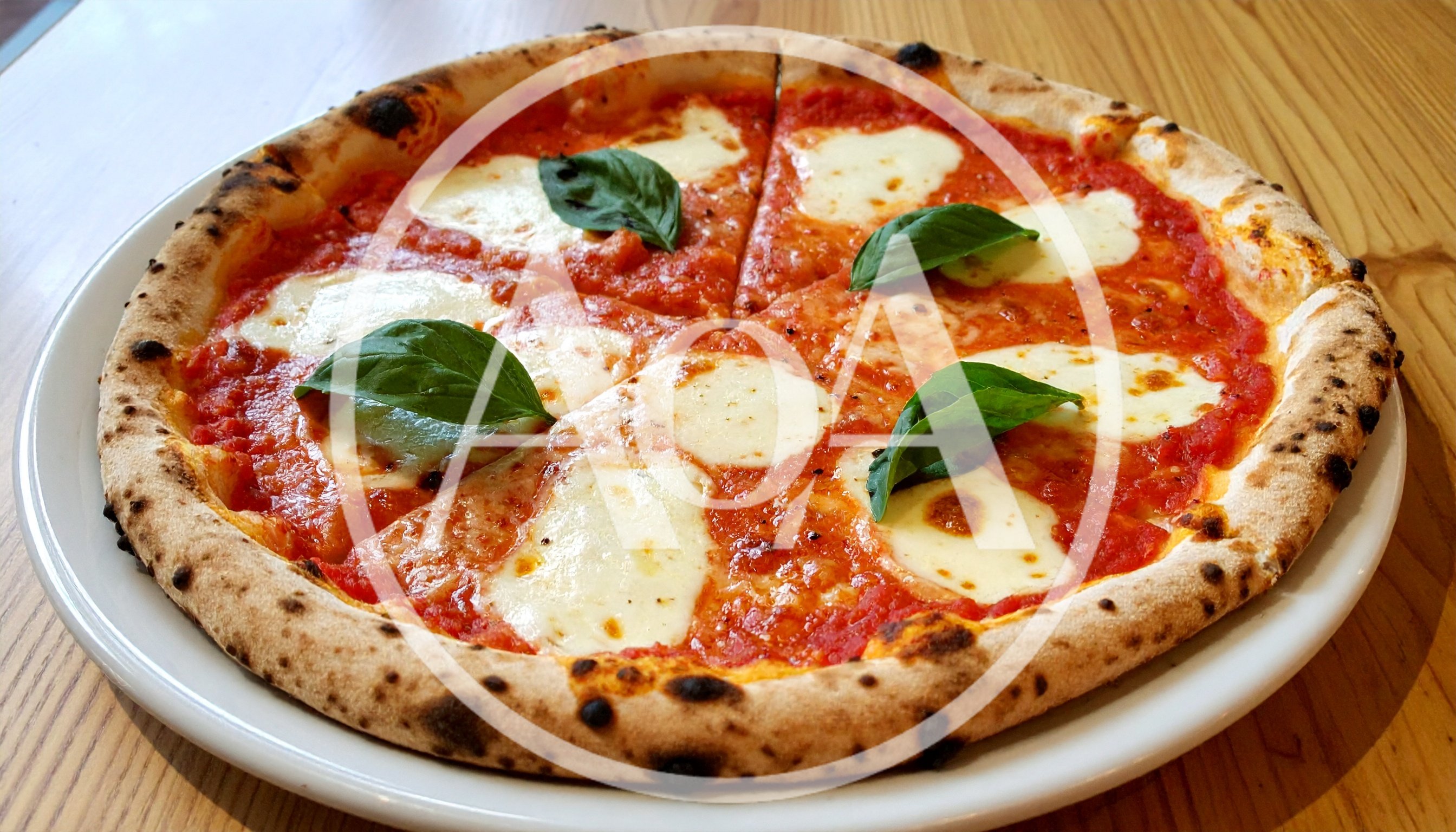 Fresh Margherita Pizza on a White Plate