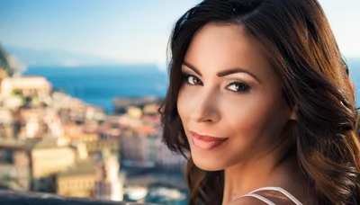 Portrait Of A Beautiful Woman Overlooking A Coastal Town