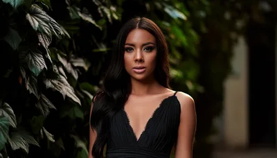 Portrait Of A Beautiful Woman In A Black Dress