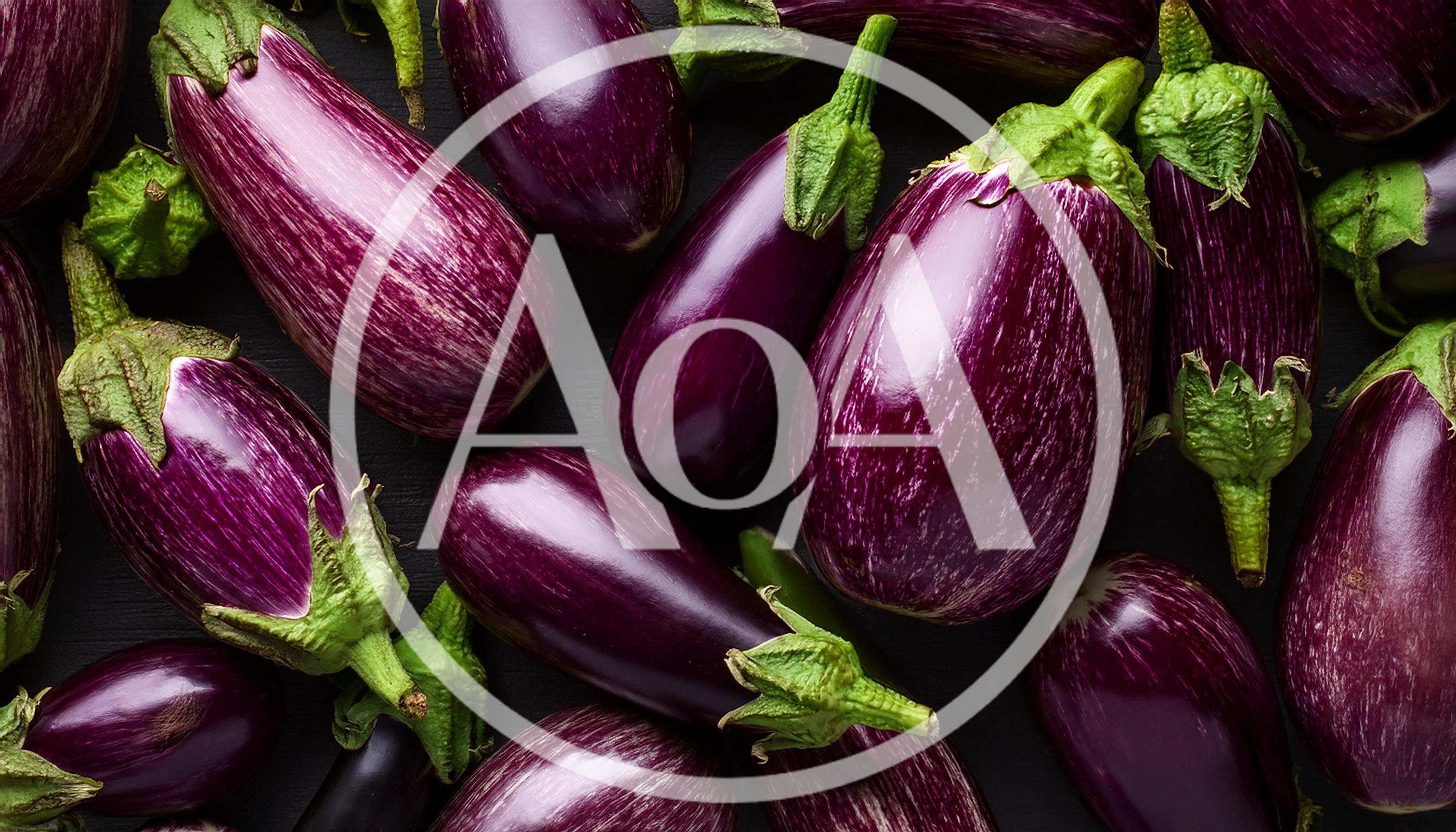 Fresh Purple Striped Eggplants On Dark Wooden Background