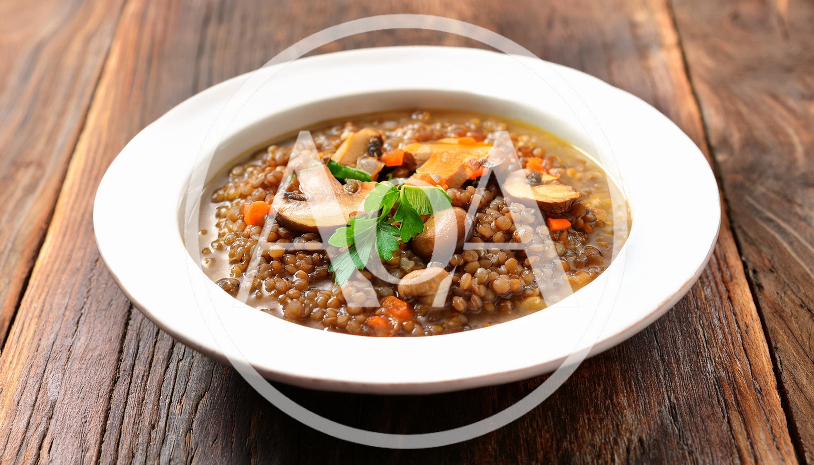 Bowl Of Lentil Soup With Mushrooms And Parsley