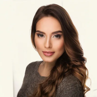 Portrait Of A Beautiful Young Woman With Long Wavy Hair