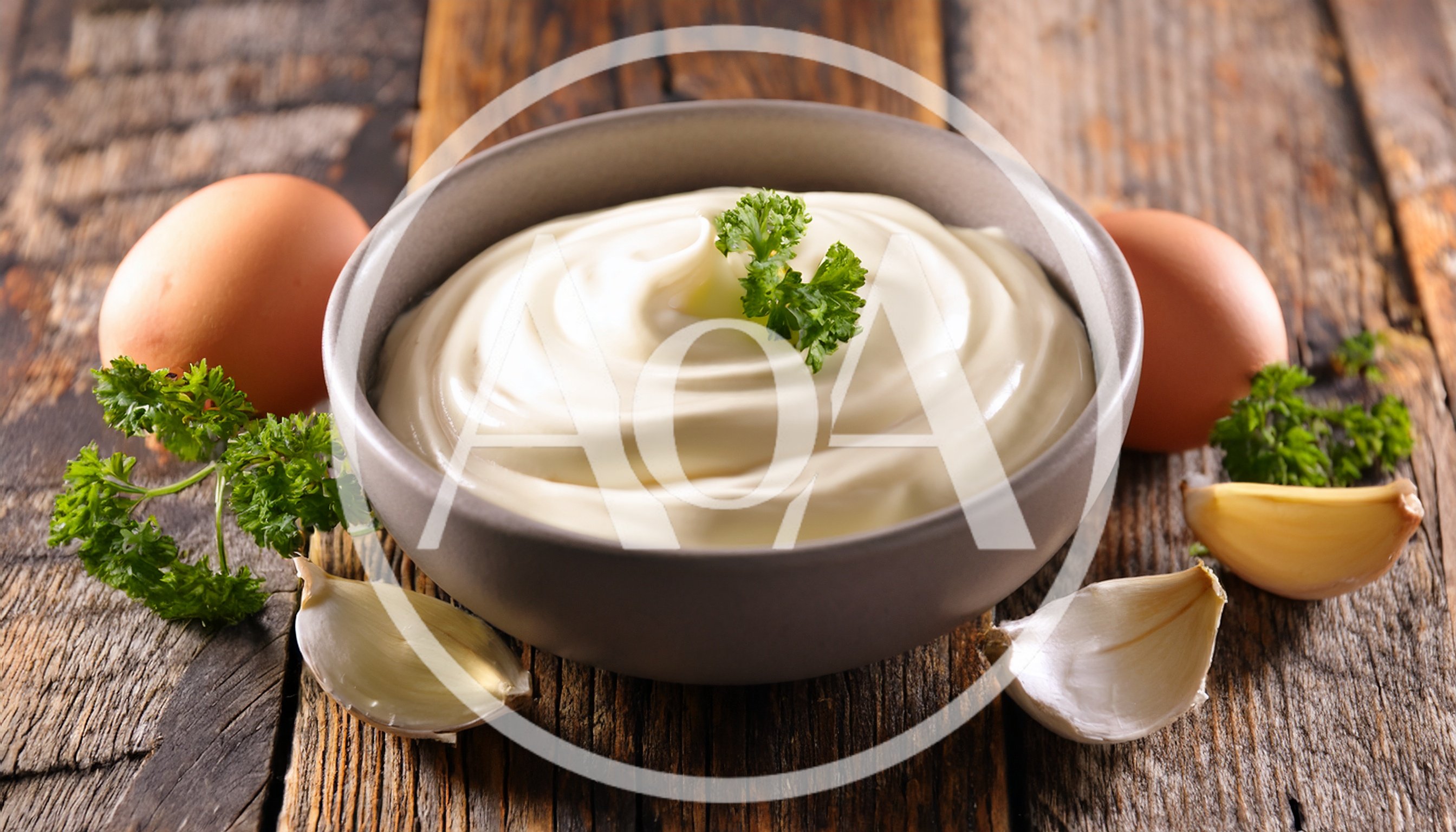 Bowl Of Fresh Homemade Mayonnaise With Garlic And Parsley