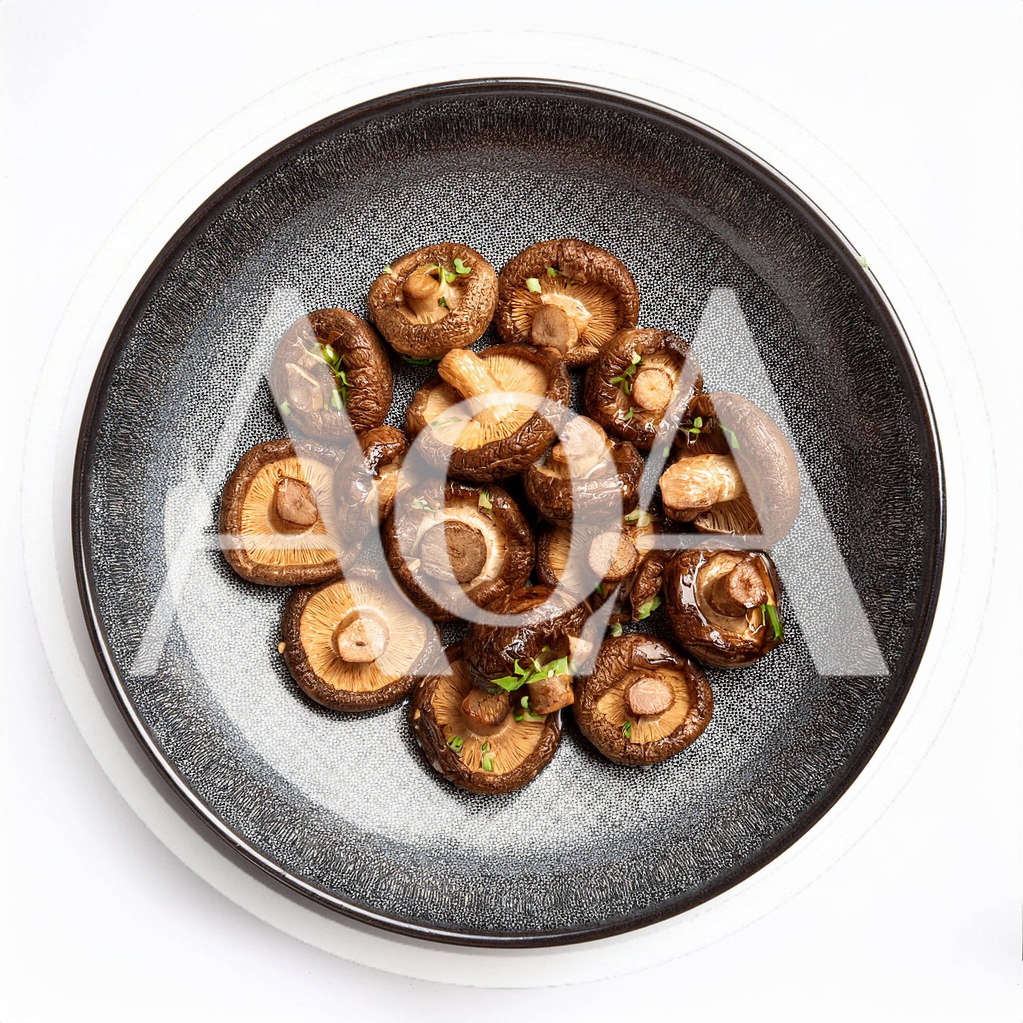 Roasted Shiitake Mushrooms On A Dark Textured Plate