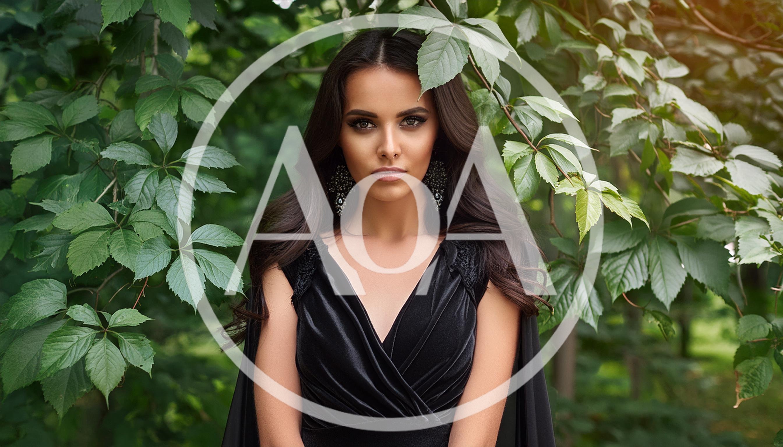 Portrait Of A Beautiful Woman In A Black Dress