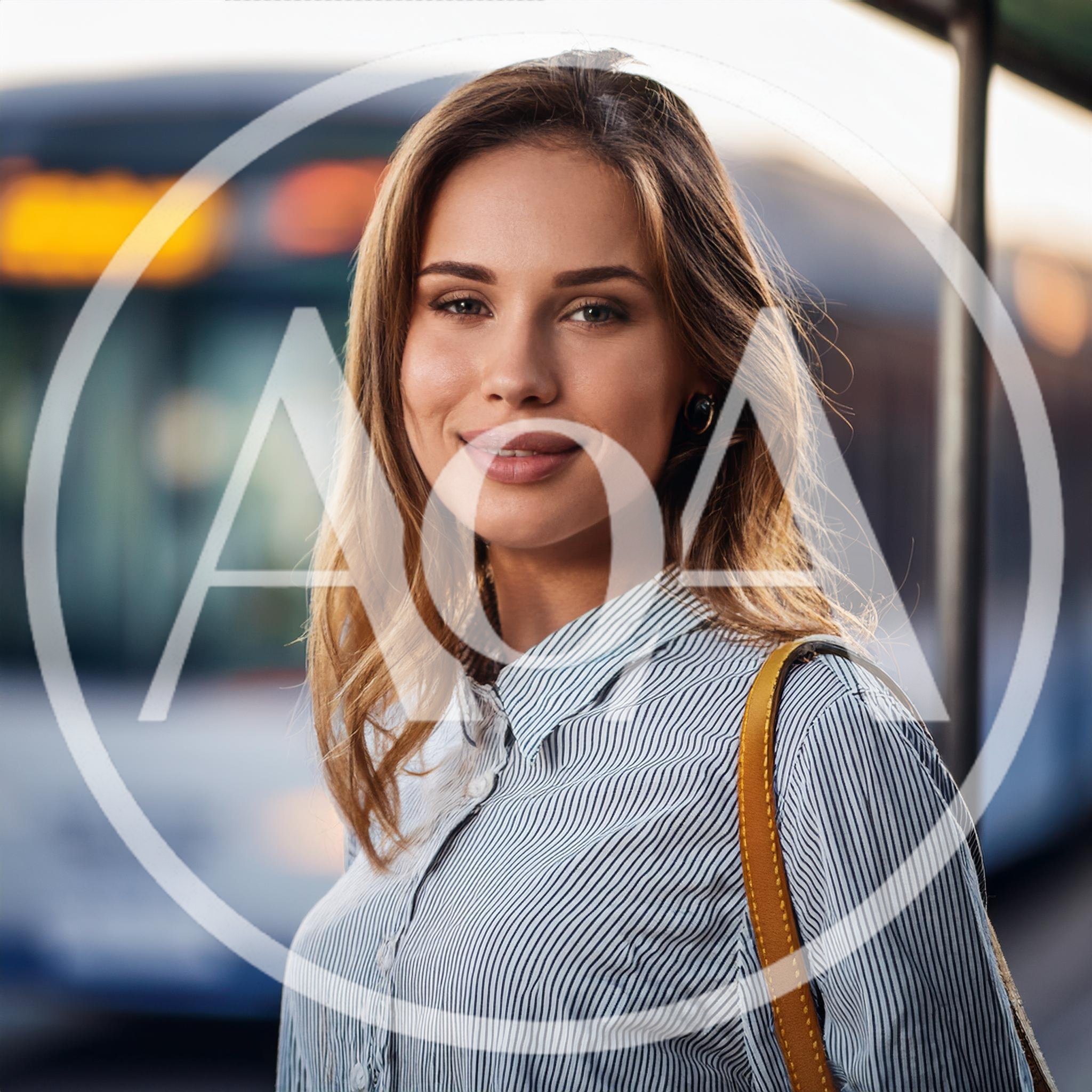 Young Woman Waiting At A Public Transit Stop