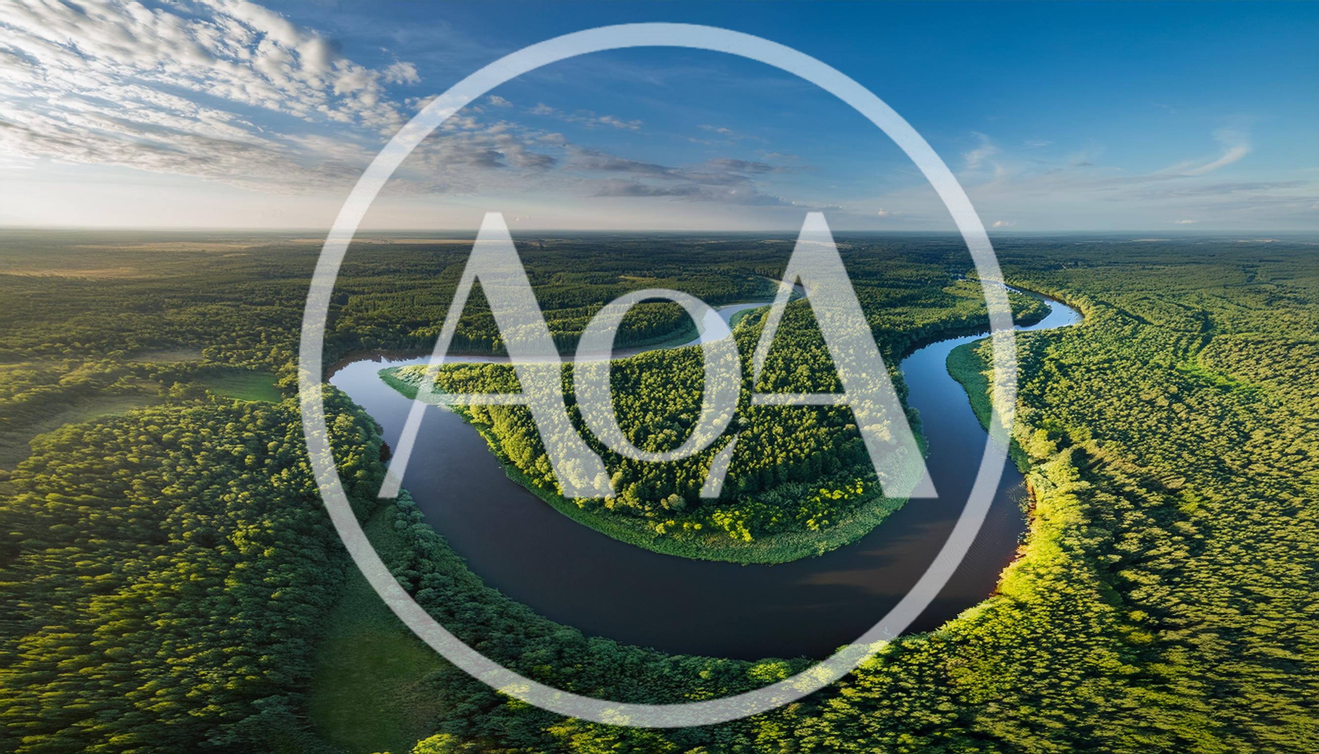Aerial View Of A Meandering River Through Dense Forest