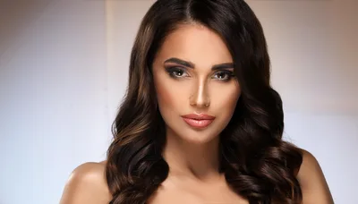 Portrait Of A Beautiful Woman With Wavy Brunette Hair