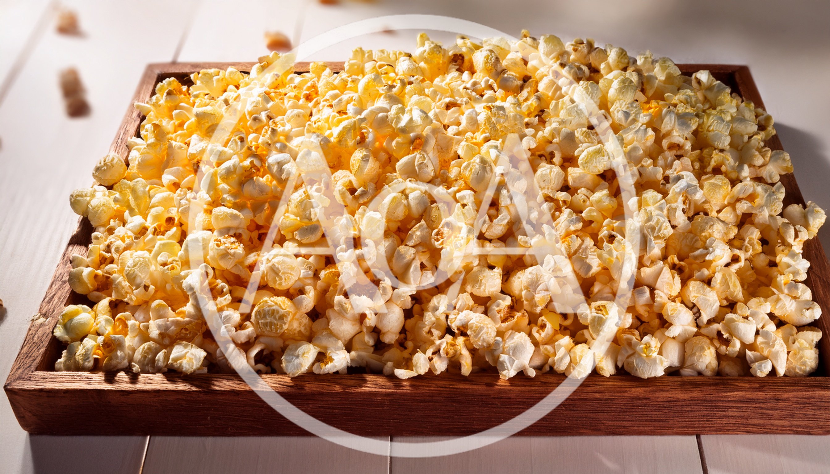 Freshly Popped Popcorn In A Wooden Tray