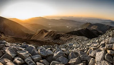 Panoramic View Of Rocky Mountain Peaks At Sunset